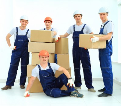 Packed moving boxes and wrapped furniture ready for house removals