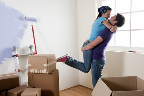 Professional house removals service for Canary Wharf residents packing and loading boxes