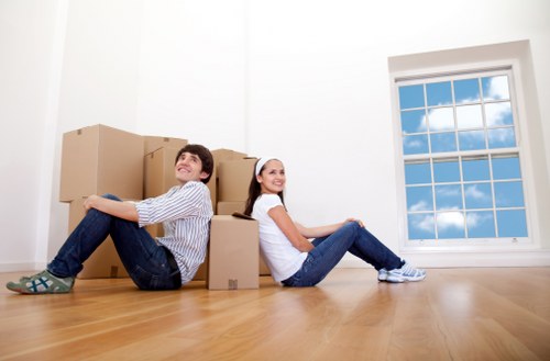 House movers unloading boxes in a Canary Wharf apartment development