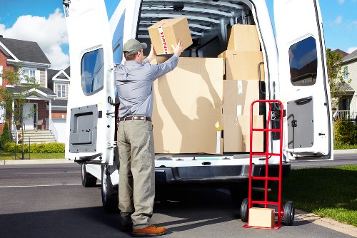Local movers handling furniture and fragile items in a Canary Wharf property move