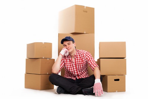 Local removal crew handling boxes and furniture in Canary Wharf